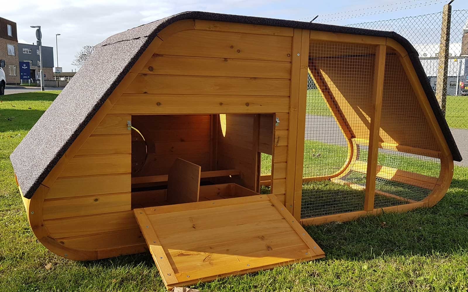 Rear view of Noah's Ark design chicken coop with open hatch