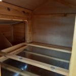 Raised chicken coop with run and nest box